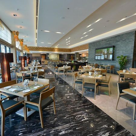 라미 그랜드 호텔 앤 스파 마나마 외부 사진 The restaurant
